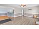 Open living room with hardwood floors, neutral paint and access to the kitchen at 104 Roscommon Ln, Clayton, NC 27520