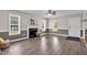 Inviting living room with hardwood floors, fireplace and lots of windows at 104 Roscommon Ln, Clayton, NC 27520