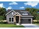 Charming gray home featuring stone accents, a modern garage, and a well-manicured lawn at 194 Aspen Ave, Pittsboro, NC 27312