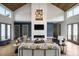 Bright living room with high ceilings, modern fireplace, and stylish decor at 194 Aspen Ave, Pittsboro, NC 27312