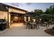 Inviting outdoor dining area with a barbecue grill and covered seating under umbrellas at 194 Aspen Ave, Pittsboro, NC 27312