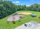 An aerial view of a playground area with baseball field and picnic shelter at 2003 Zbonack Ct, Creedmoor, NC 27522