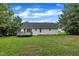 A charming home with a spacious backyard and a deck perfect for enjoying the outdoors and entertaining guests at 2003 Zbonack Ct, Creedmoor, NC 27522