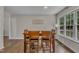 An interior view of a dining room with a table and chairs with wood flooring and a large window at 2003 Zbonack Ct, Creedmoor, NC 27522