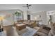 Comfortable living room featuring a large sofa, ottoman, and side chair with a view outside at 2003 Zbonack Ct, Creedmoor, NC 27522