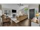 Living room with a modern fireplace and vaulted ceiling and a window with blinds at 2003 Zbonack Ct, Creedmoor, NC 27522
