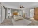 Spacious main bedroom with a ceiling fan, carpeting, and an ensuite bathroom at 2003 Zbonack Ct, Creedmoor, NC 27522