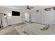 Spacious main bedroom with a ceiling fan, carpeting, ensuite bathroom, and closets at 2003 Zbonack Ct, Creedmoor, NC 27522