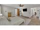Spacious main bedroom with a ceiling fan, carpeting, an ensuite bathroom, and TV at 2003 Zbonack Ct, Creedmoor, NC 27522