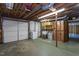 Unfinished basement with exposed wood beams, laundry area, and utility sink at 3603 Grimes Ave, Durham, NC 27703