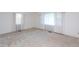 Bright, empty bedroom featuring neutral carpet and large windows at 3603 Grimes Ave, Durham, NC 27703
