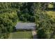 An aerial view shows the home and its surrounding landscaping at 3603 Grimes Ave, Durham, NC 27703