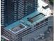 Close aerial view of high-rise building with open-air areas on the parking garage rooftop at 400 W Main St # 2007, Durham, NC 27701