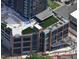 Newer commercial building with rooftop patio area under construction in an urban setting at 400 W Main St # 2007, Durham, NC 27701