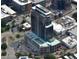 Aerial view of high-rise building showing the building within the surrounding neighborhood, streets, and parking areas at 400 W Main St # 2007, Durham, NC 27701