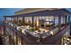 Elegant rooftop lounge featuring comfortable seating areas, a bar, and stunning views of the city skyline at 400 W Main St # 2007, Durham, NC 27701