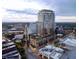 Exterior rendering of a high-rise showing top-level amenities like a pool and lounge areas at 400 W Main St # 2502, Durham, NC 27701