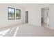 Serene bedroom showcases neutral carpet, ample natural light, and an ensuite bathroom entrance at 104 Birdie Court, Pittsboro, NC 27312