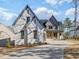 Beautiful new construction with white painted brick, gray siding and three-car garage at 104 Birdie Court, Pittsboro, NC 27312