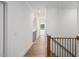 Bright hallway features hardwood floors and white walls, creating a clean and open feel at 104 Birdie Court, Pittsboro, NC 27312