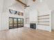 Bright living room with fireplace, built-ins and large glass doors to the outdoor deck at 104 Birdie Court, Pittsboro, NC 27312