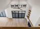 Vaulted ceiling and large windows flood this living room with natural light, complementing the modern design at 104 Birdie Court, Pittsboro, NC 27312