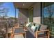 Outdoor balcony space featuring a cozy seating area, great for relaxing and entertaining guests at 600 N Roxboro St # 41, Durham, NC 27701