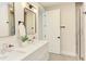 Bathroom featuring a double sink vanity with modern fixtures and tiled shower enclosure at 600 N Roxboro St # 41, Durham, NC 27701