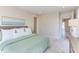 Bright bedroom featuring a comfortable bed, soft carpet and access to an ensuite bathroom at 600 N Roxboro St # 41, Durham, NC 27701