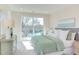 Bright bedroom featuring a large bed and natural light with balcony access at 600 N Roxboro St # 41, Durham, NC 27701