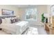 Bright bedroom with large window view, a queen bed and plenty of natural light at 600 N Roxboro St # 41, Durham, NC 27701