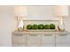 Elegant decor showcases modern design with lamps, natural moss spheres, and a sleek wood cabinet at 600 N Roxboro St # 41, Durham, NC 27701