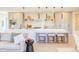 Open concept kitchen and living area with eat in countertop and modern stools at 600 N Roxboro St # 41, Durham, NC 27701