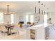 Bright, open-concept living and dining area features modern lighting and luxury furnishings at 600 N Roxboro St # 41, Durham, NC 27701