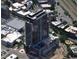 A new high-rise residential tower viewed aerially with a rooftop area and views of city buildings and streets at 400 W Main St # 2002, Durham, NC 27701