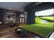Exclusive golf simulator room with lounge area, perfect for year-round practice and entertainment at 400 W Main St # 2002, Durham, NC 27701