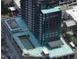 This aerial view showcases the building's structure, architectural elements, and rooftop under construction at 400 W Main St # 2010, Durham, NC 27701
