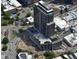 This aerial view highlights the building's architectural design, multiple floors, and rooftop amenities at 400 W Main St # 2010, Durham, NC 27701