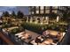 Rooftop terrace with outdoor seating, fire pit, and lush landscaping at 400 W Main St # 2010, Durham, NC 27701