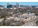 An aerial view of townhomes with a beautiful city skyline in the background at 610 Walnut Hts Dr # 102, Raleigh, NC 27610