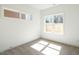 Bright bedroom featuring neutral carpet, white walls, and a window with natural light at 610 Walnut Hts Dr # 102, Raleigh, NC 27610