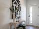 Inviting entryway featuring modern art and sleek console table near the front door at 610 Walnut Hts Dr # 102, Raleigh, NC 27610