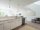 Bright and airy kitchen with modern white cabinetry and stainless steel dishwasher at 610 Walnut Hts Dr # 102, Raleigh, NC 27610