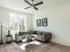 Cozy living area features a comfortable sofa, area rug and natural light at 610 Walnut Hts Dr # 102, Raleigh, NC 27610