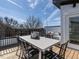 Inviting outdoor dining area on a wooden deck with black metal furniture at 610 Walnut Hts Dr # 102, Raleigh, NC 27610