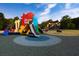 Colorful and engaging playground with slides and play structures in a community park at 610 Walnut Hts Dr # 102, Raleigh, NC 27610