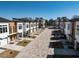 Modern townhomes line a beautifully paved street in a new residential community at 610 Walnut Hts Dr # 102, Raleigh, NC 27610