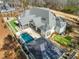 Home's rear elevation, showcasing pool and patio at 291 Riverstone Dr, Pittsboro, NC 27312