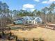 Luxury home with a large driveway and mature landscaping at 291 Riverstone Dr, Pittsboro, NC 27312
