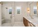 Elegant bathroom featuring a walk-in shower and double vanity at 291 Riverstone Dr, Pittsboro, NC 27312